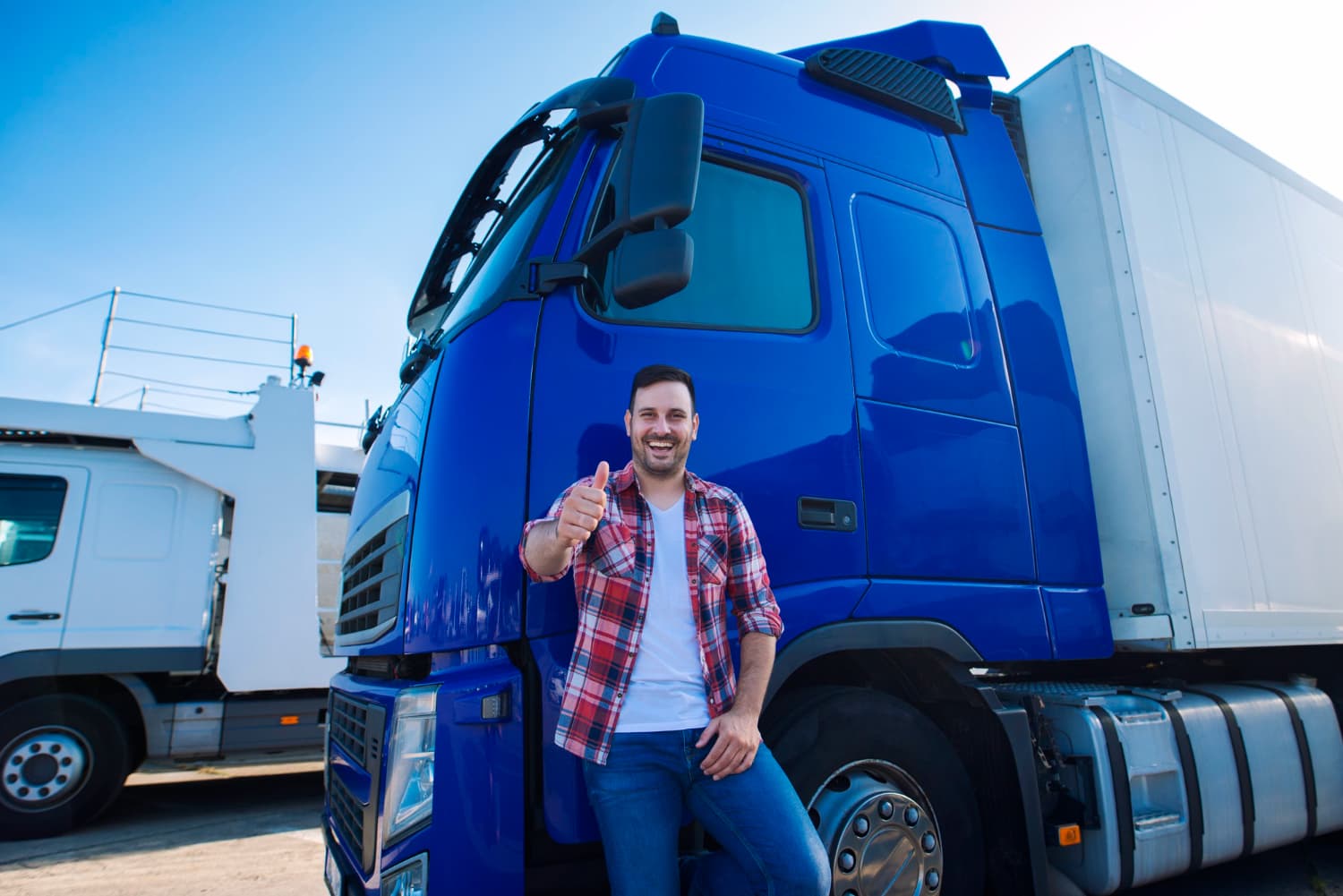 truck driver in front of a truck
